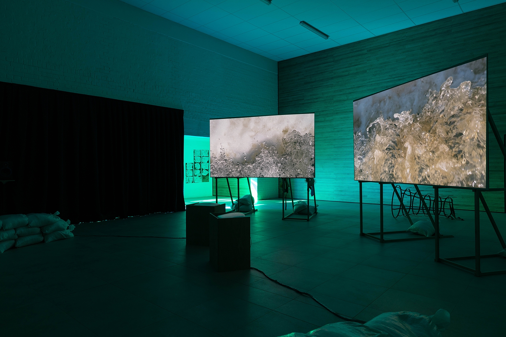 http://mail.abrideswardt.com/files/gimgs/th-81_Installation view Abri de Swardt, Kammakamma (2022-2024), Synchronised two-channel projection, configurable screens, sand from Macassar Dunes, and costumes, 16’54 min 6.jpg